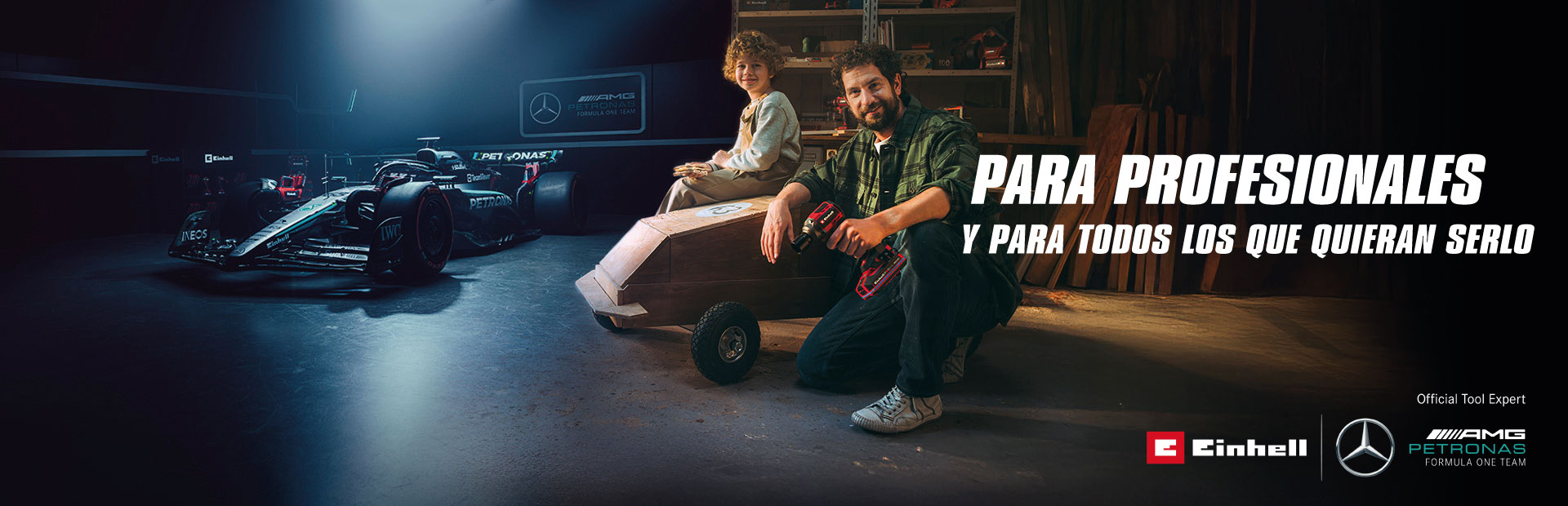 Un padre y su hijo en un taller con un coche de jabón casero. Al fondo, un coche de Fórmula 1 del equipo Mercedes-AMG PETRONAS y herramientas Einhell. A la derecha, el texto dice: "Para profesionales y quienes quieren llegar a serlo."