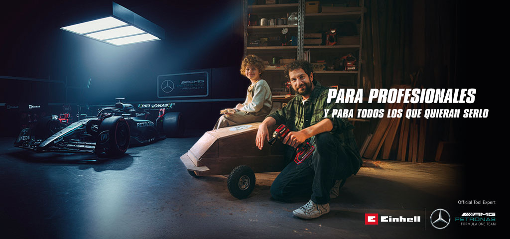 Un padre y su hijo en un taller con un coche de jabón casero. Al fondo, un coche de Fórmula 1 del equipo Mercedes-AMG PETRONAS y herramientas Einhell. A la derecha, el texto dice: "Para profesionales y quienes quieren llegar a serlo."